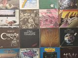 a lot of different album covers on the wall