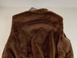 a close up of a brown fur purse on a white surface