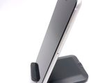 a cell phone that is sitting on top of a cell phone stand