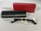 cartier eyeglasses in black and gold with clear lenses