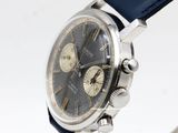 an image of a close up of a wrist watch on a white surface