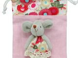 a small bag with a stuffed animal inside of it