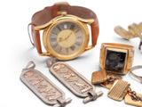 a lot of different items that include a watch, keychain, and other items