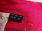 the back of a pink pants with a black label on it