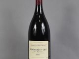 a bottle of wine that is sitting on a table