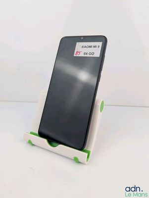 a phone that is sitting on a stand on the table