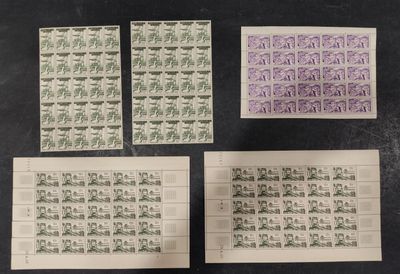 four different stamps are on top of each other on a table