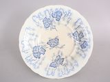 a blue and white plate with flowers on it