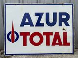 a sign that says azur total in red, white and blue