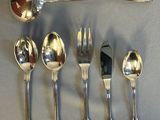 a lot of spoons and spoons that are on the table