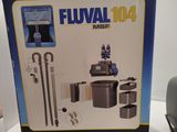 boxed box of fluval 104 water filtrator on a white table