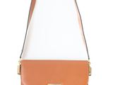 a tan leather shoulder bag with a gold clasp