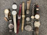 a lot of watches that are sitting on the floor
