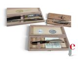 three different types of knives in a wooden box