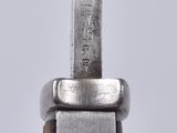 a close up of a knife on a white surface
