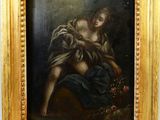 une peinture représentant une femme tenant un bébé dans ses bras