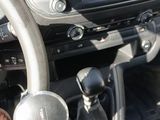 a car dashboard with a steering wheel and a dash board