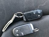 two car keys that are sitting on the seat of a car