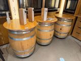 three wine barrels that are stacked on top of each other