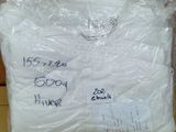 a bag of toilet paper sitting on top of a cardboard box