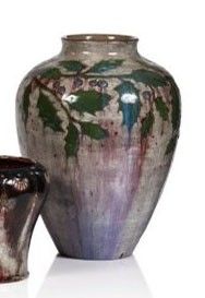 two vases sitting next to each other on a white surface