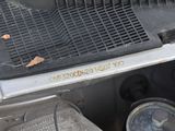 a dirty car that has been left on the ground