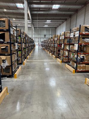 a large warehouse filled with lots of boxes and pallets