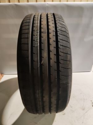 a close up of a tire on a white surface