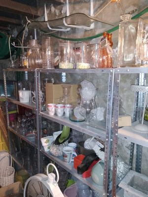 a room filled with lots of glassware and other items