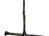 a black and silver clarinet on a white background
