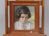 painting of a young girl in a white shirt in a wooden frame