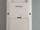 a white nintendo game console sitting on a table