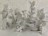 a group of figurines of angels on a table