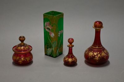 three small vases sitting next to each other on a table