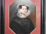 un tableau représentant une femme en robe noire, avec une dentelle blanche sur la tête