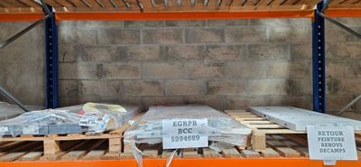 many pallets that are sitting on a pallet in a warehouse