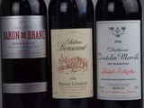three bottles of wine sitting next to each other on a table