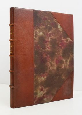 a close up of a book with a brown cover on a white surface