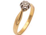 a close up of a gold and diamond ring on a white background