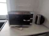 a microwave sitting on a counter in a kitchen