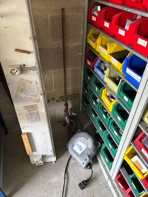 many bins of assorted items in a storage room