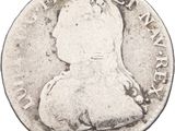a close up of a coin on a white background