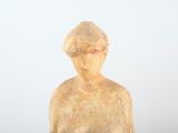 a statue of a woman holding a bowl of food