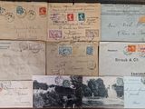 several old postcards and envelopes on a table with a black and white photo of a man