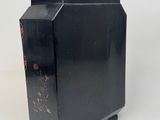 an image of a black vase with a flower design on it