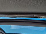 a view of the sunroof from inside of a car