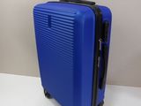a blue suitcase that is sitting on a table