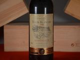 a bottle of wine that is sitting on a table