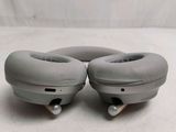 pair of headphones sitting on top of each other on a white surface