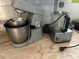 a mixer and a blender sitting on a kitchen counter